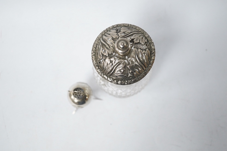 A Georgian silver mounted cut glass caster, London, 1818, 15.7cm, together with a Japanese silver condiment on tripod supports, import marks for Harrods Ltd, London, 1920. Condition - poor to fair